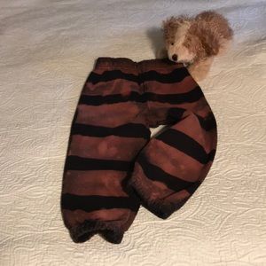 Sweatpants, striped with reverse bleaching.